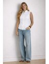 Sleeveless Peter Pan collar blouse featuring a classic...